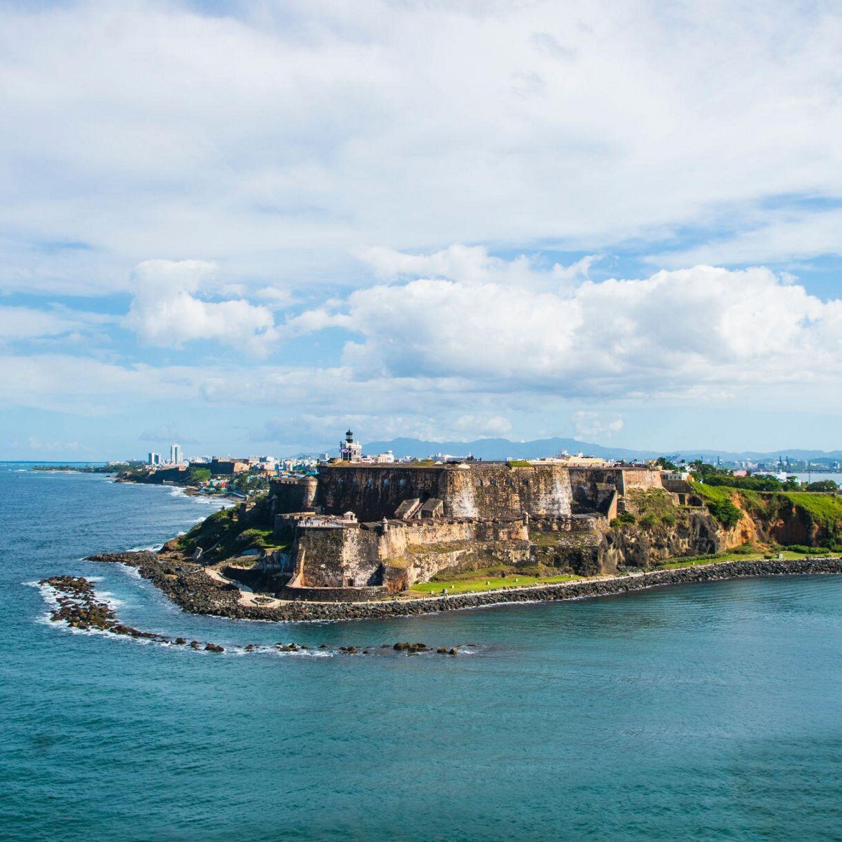 Puerto Rico Coastline, showcasing turquoise waters and lush greenery.