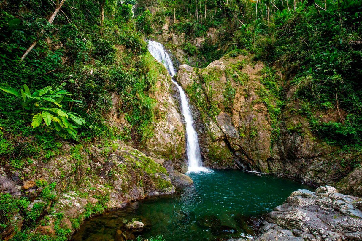 Doña Juana Falls flows through rock layers in the central mountains of Puerto Rico.