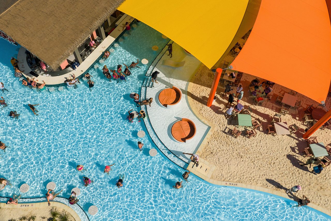 Cool off at Long Necks Swim-Up Bar.