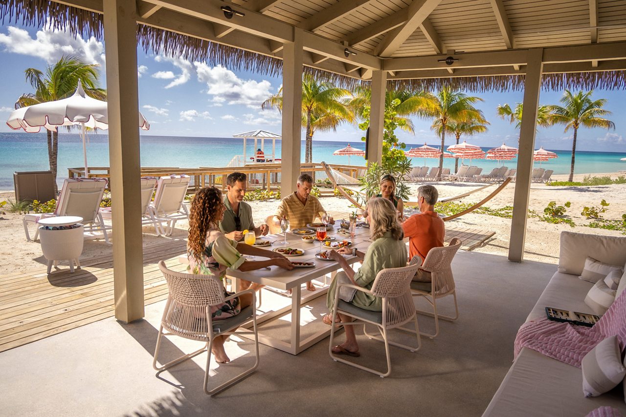 Sharing a meal in a Pearl Cove Beach Club Super Villa.