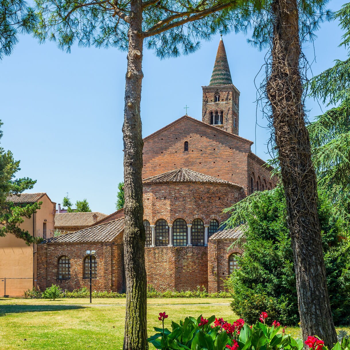 Step into centuries of history at the Basilica of San Giovanni Evangelista, where peaceful gardens frame one of Ravenna’s oldest churches.