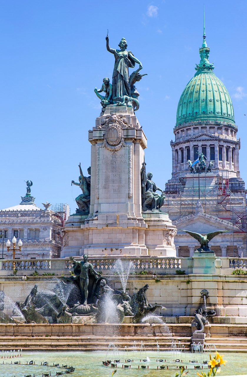 Monument and fountain in front of the domed National Congress building in Buenos Aires.