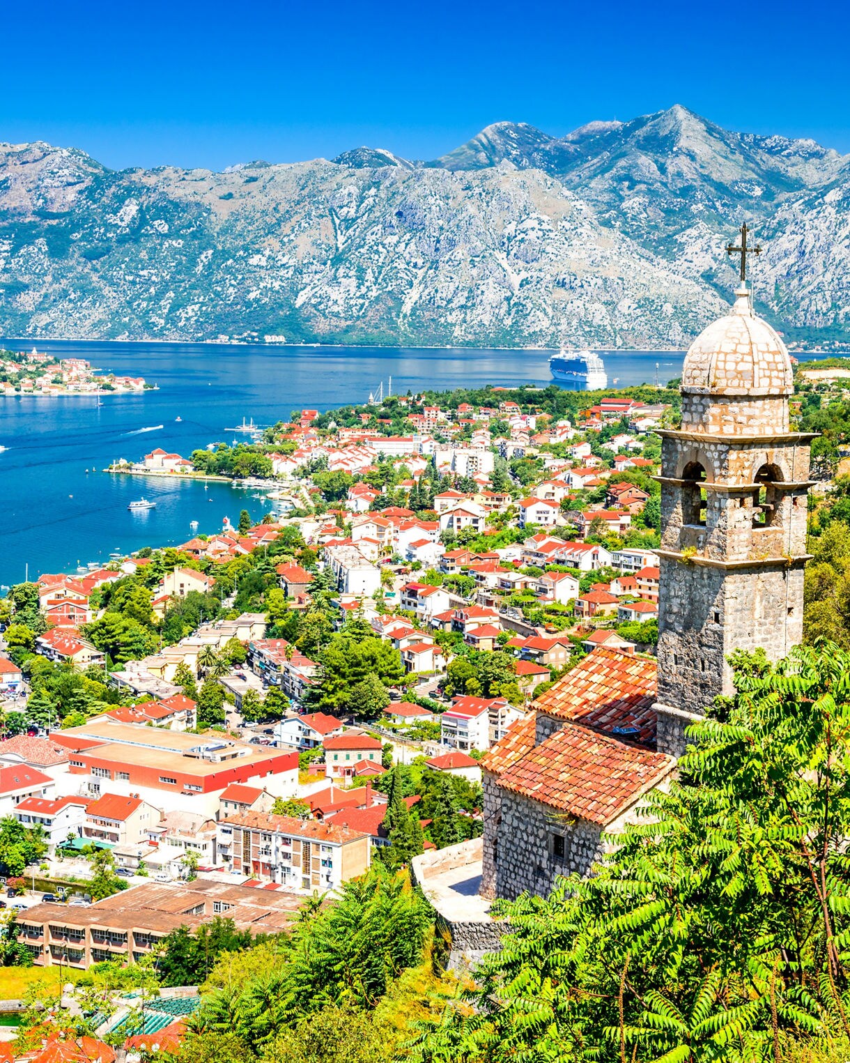Kotor, Montenegro. Bay of Kotor bay is one of the most beautiful places on Adriatic Sea, it boasts the preserved Venetian fortress, old tiny villages, medieval towns and scenic mountains.