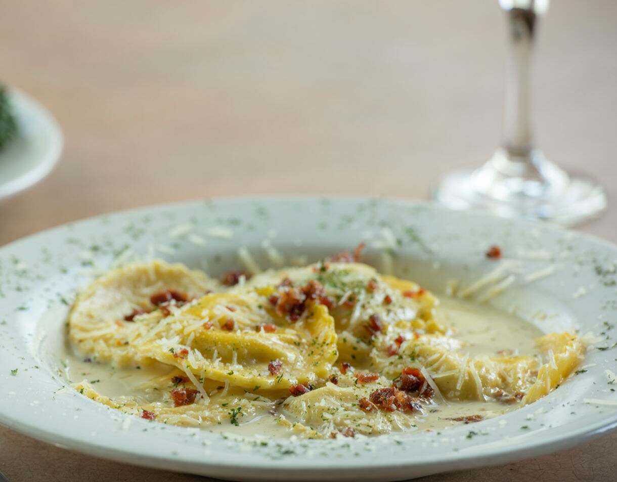  Mushroom ravioli drizzled in a brown butter sauce.