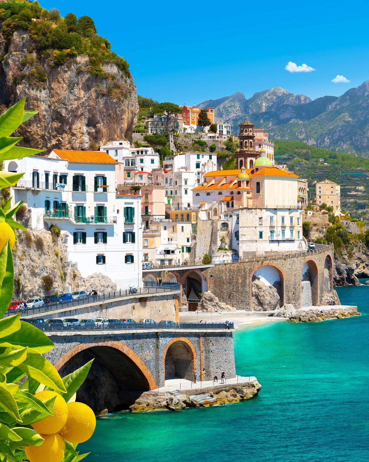 Beautiful view of Amalfi on the Mediterranean coast with lemons in the foreground, Italy.