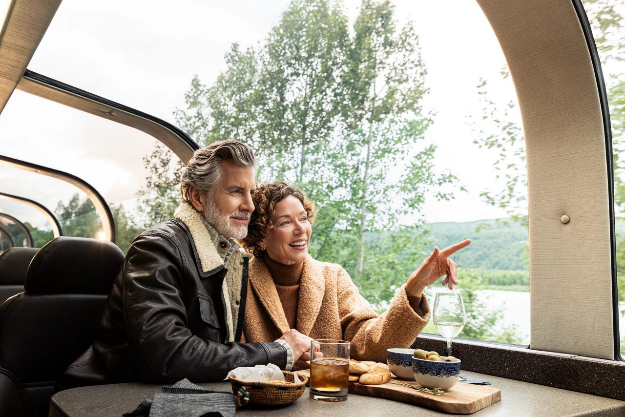 Scallops served over a bed of vegetables.