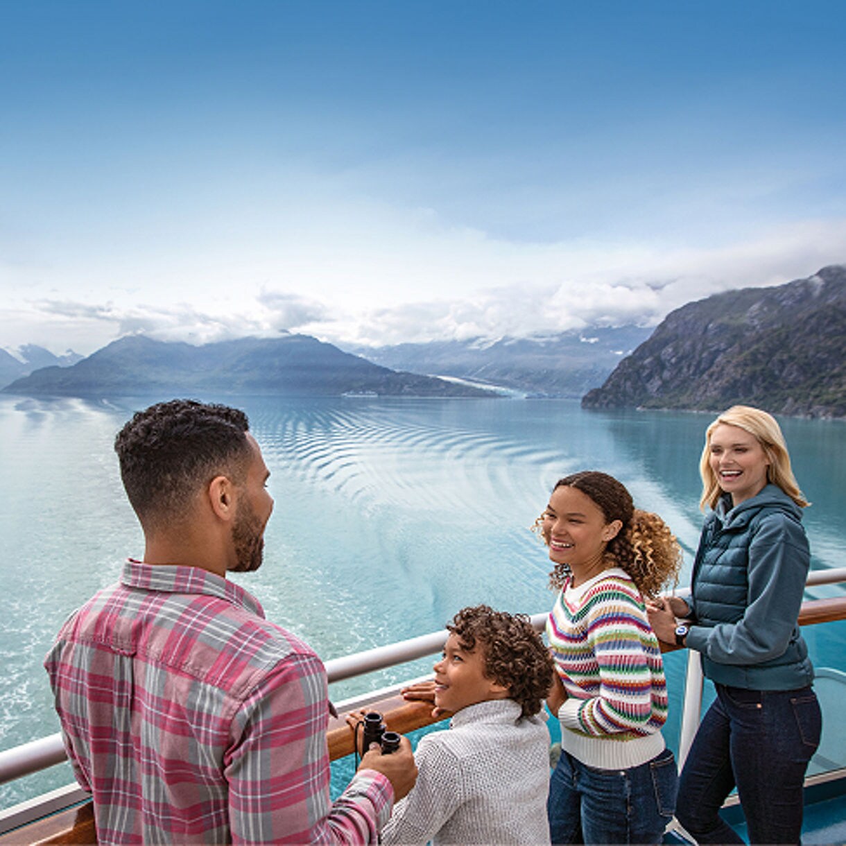 The image shows a family enjoying their time in a cruise. 