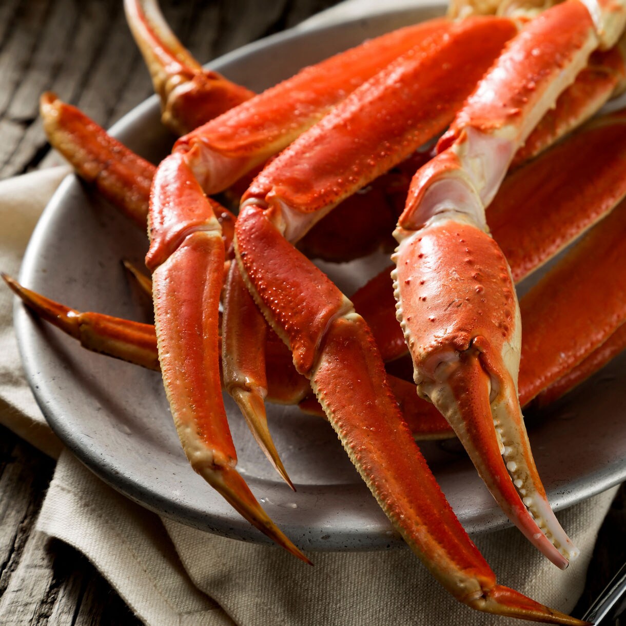King Crab lets sitting on top of a plate at an Alaska restaurant.
