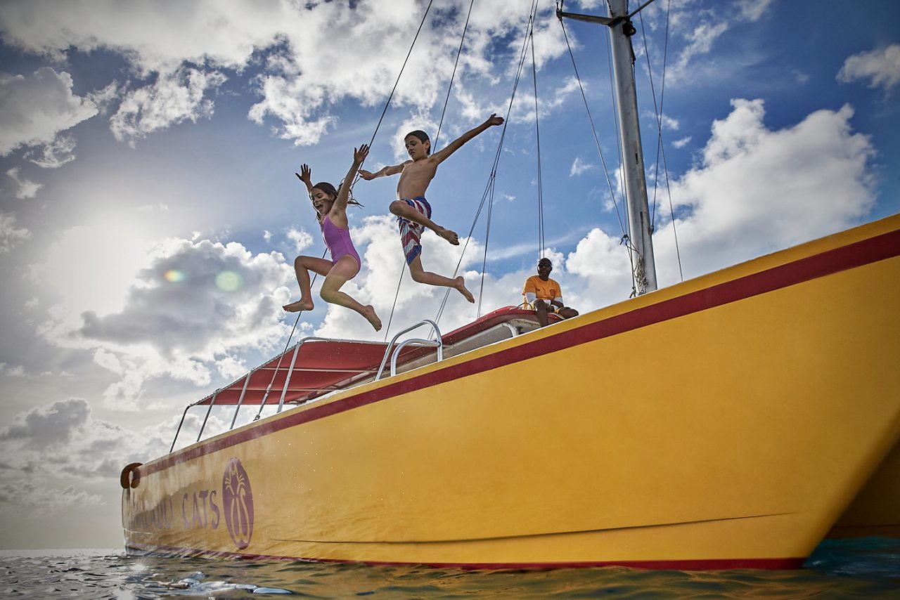 Jumping from a catamaran in Antigua.