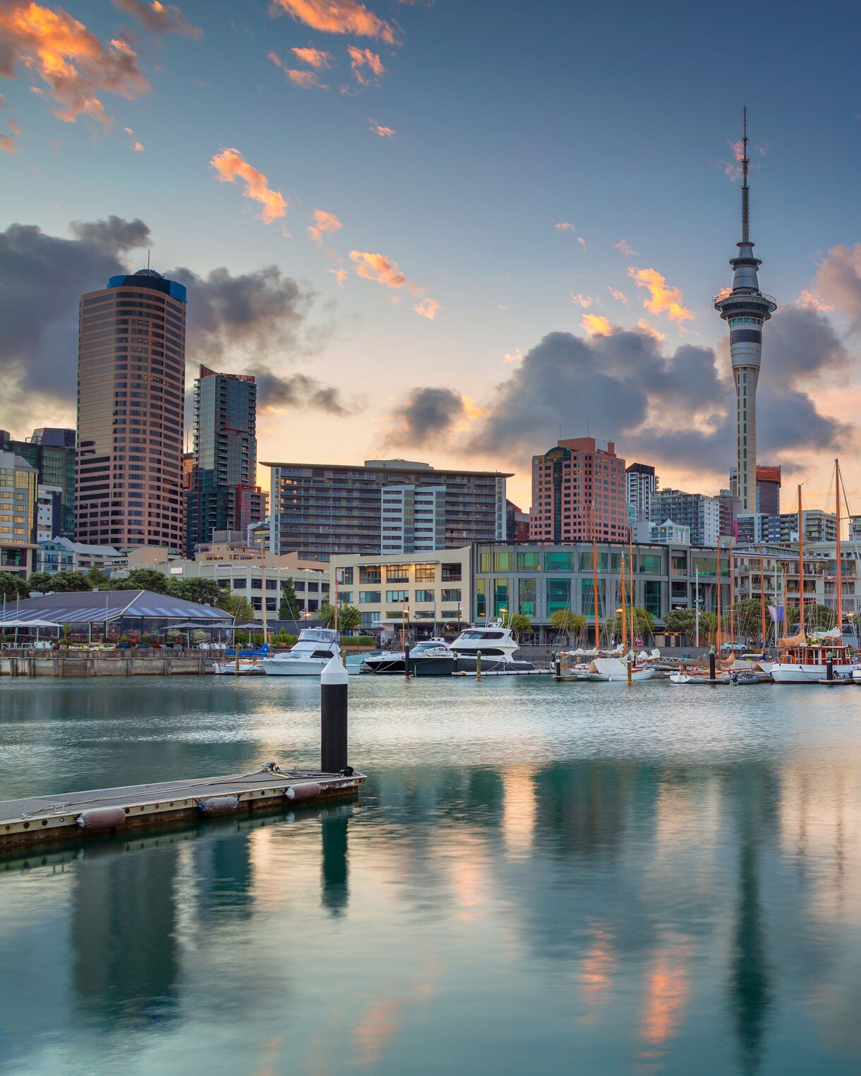 Cityscape image of Auckland skyline, New Zealand during sunrise.