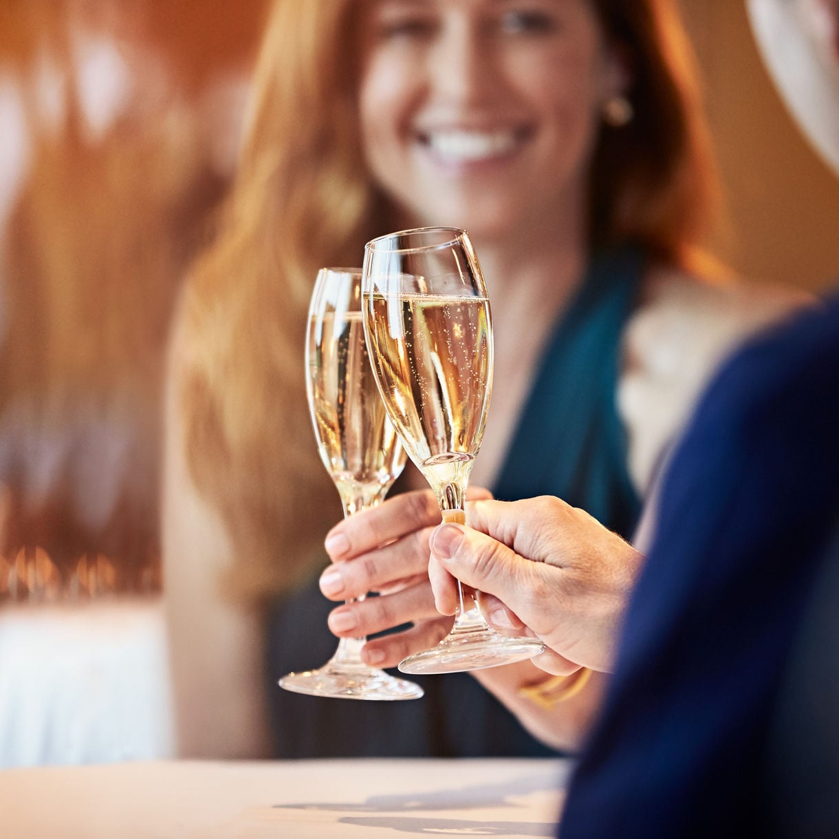 beverages couple toasting champagne smiling