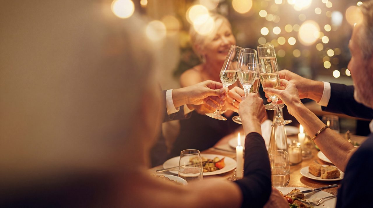 Glasses of wine in the air making a toast