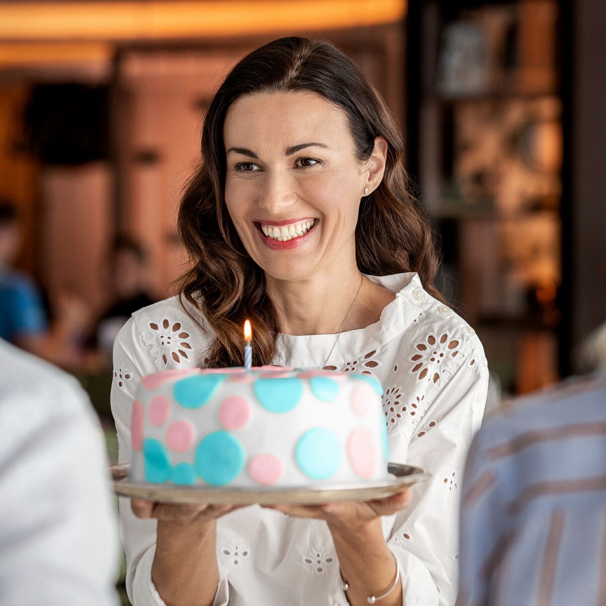 celebrations cake woman with couple cake candle onboard