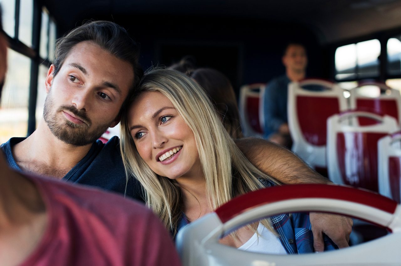 A couple taking a ferry bus.