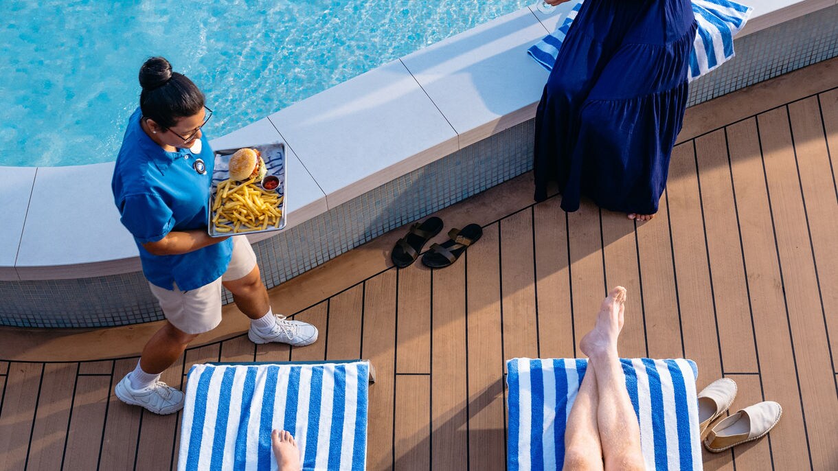 Father and son enjoying some refreshments being delivered to them.