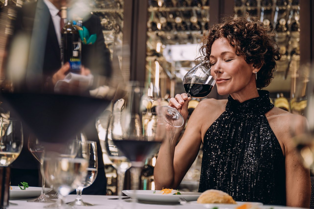 An elegantly set dining table at Crown Grill featuring fine tableware, ambient lighting, and a luxurious setting for an upscale dining experience.