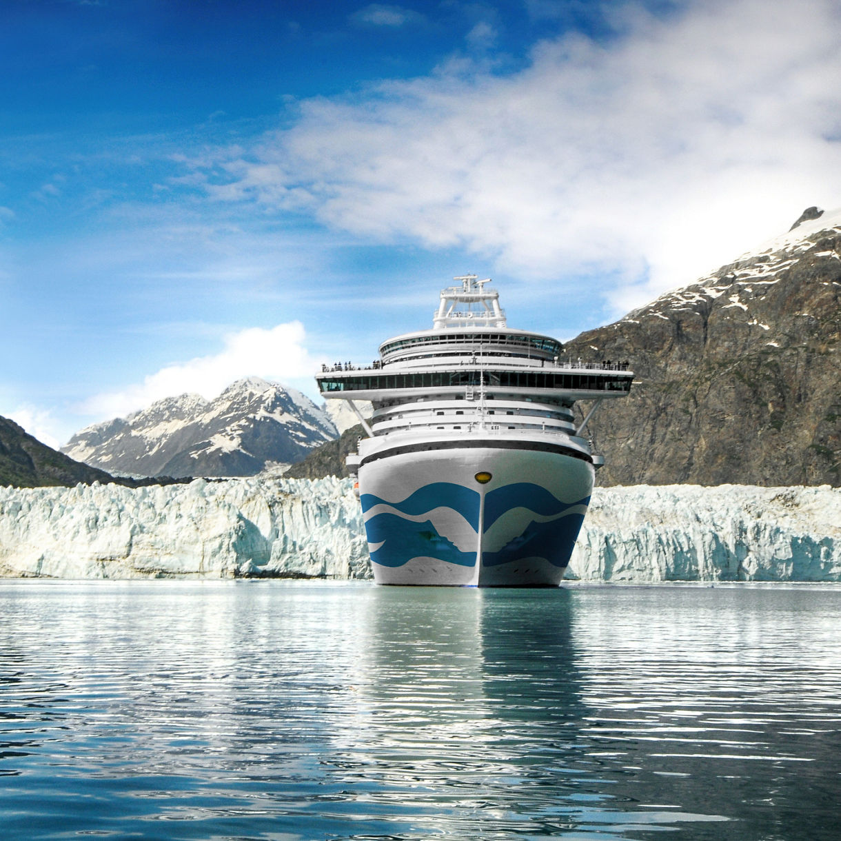 Princess Cruises ship near Glacier Bay with icy blue water and towering Alaskan scenery.