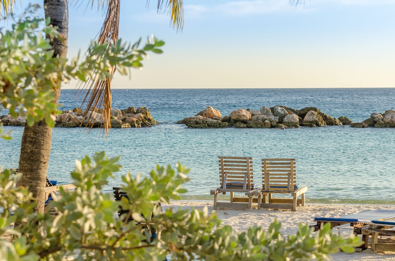 Sunbathe on the beach in Willemstad, Curacao.