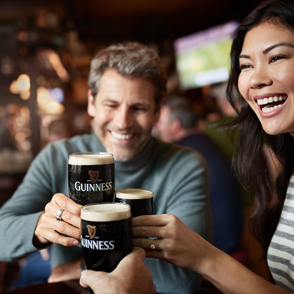 Friendship and Guinness in Dublin's vibrant atmosphere.