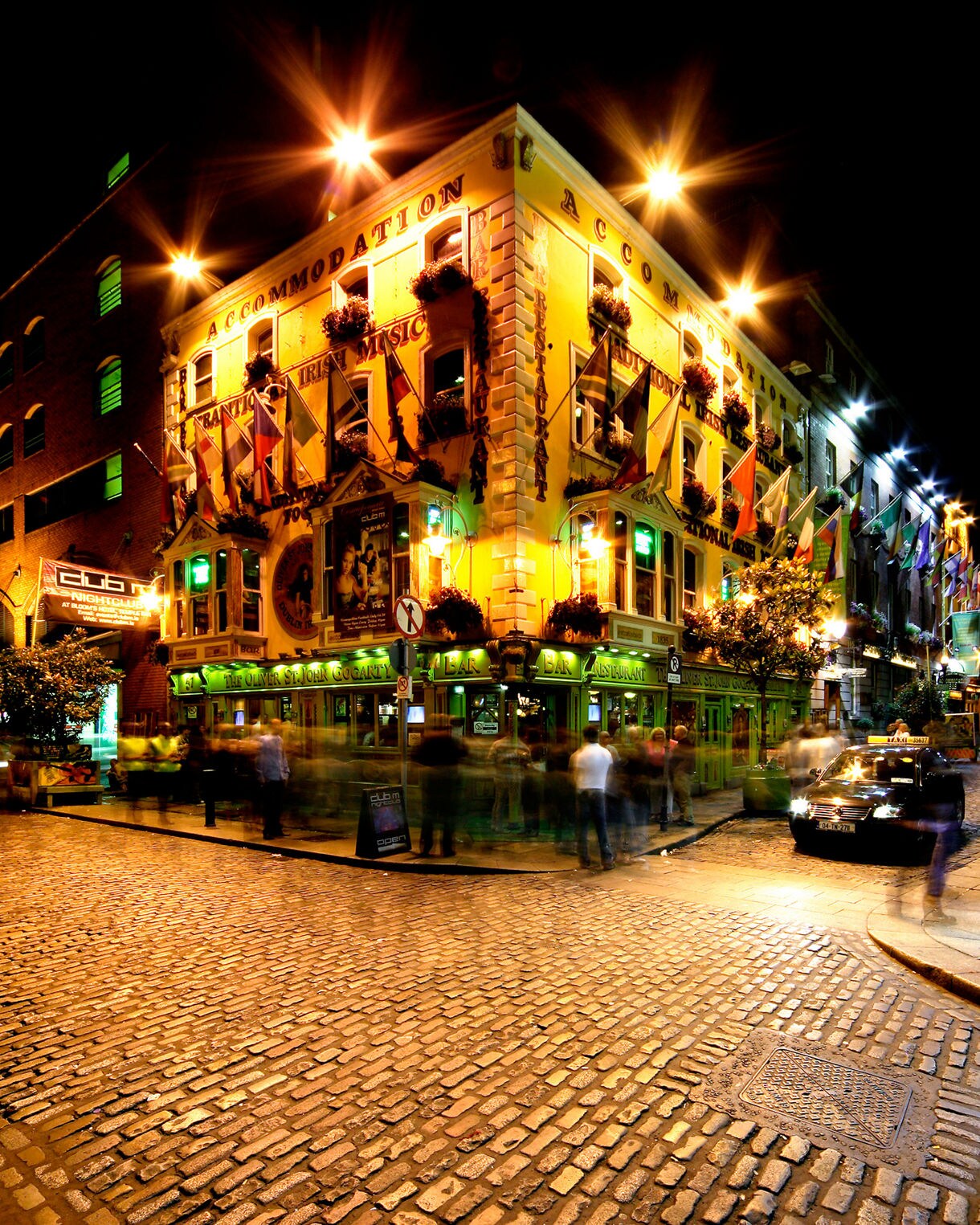 Temple Bar area in Dublin, Ireland, illuminated at night.