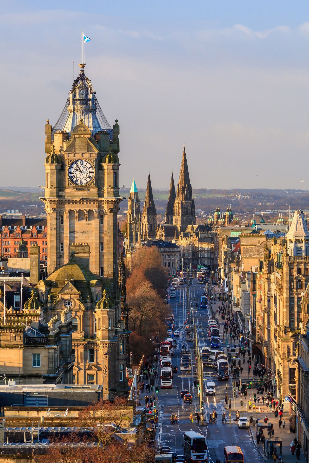 Aerial view of Princes Street in Edinburgh with the Balmoral clock tower and church spires.