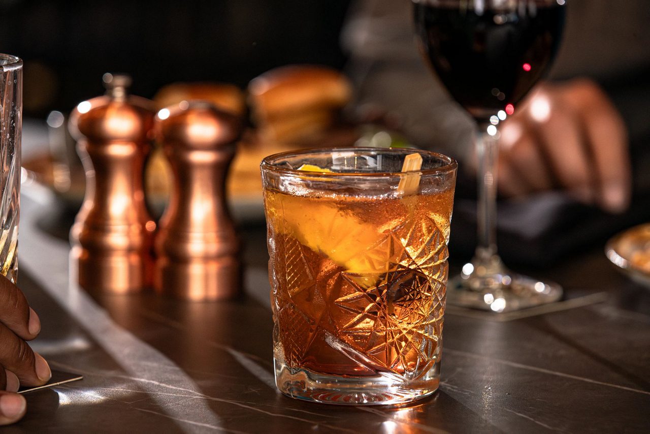 Scallops served over a bed of vegetables.