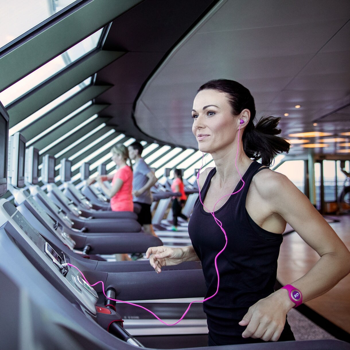 Woman running on treadmill.