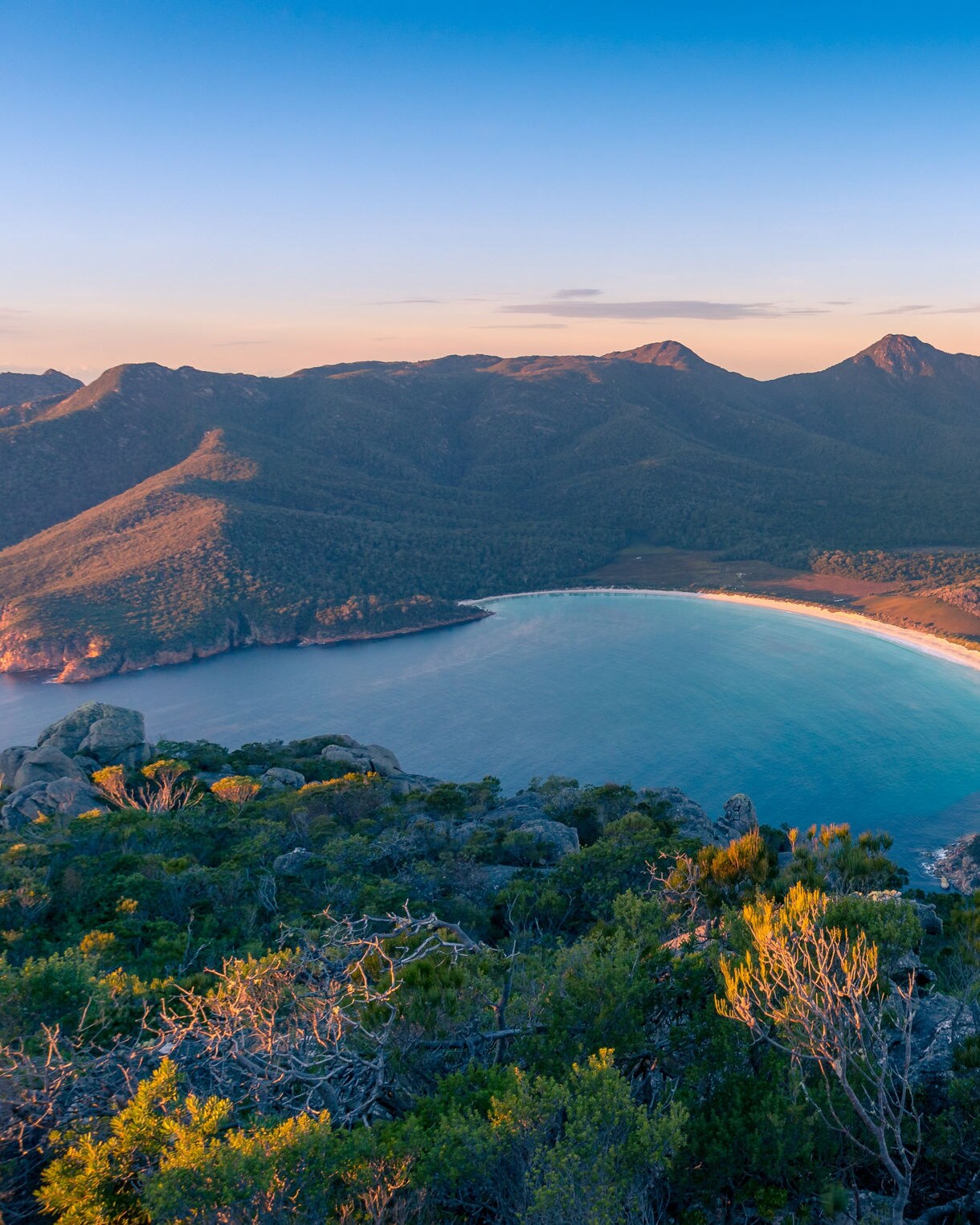 Sunrise nature landscape of beautiful bay and mountains.