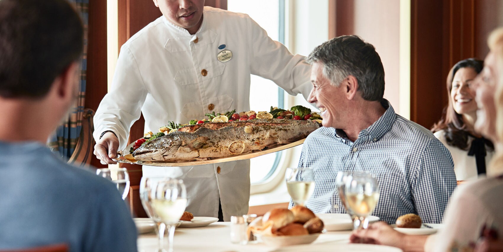 A large fish platter being prepared by chef on an Alaskan Cruise.