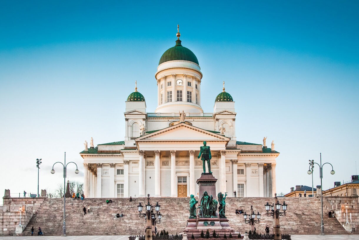 Statues in front of a historical church in Helsinki