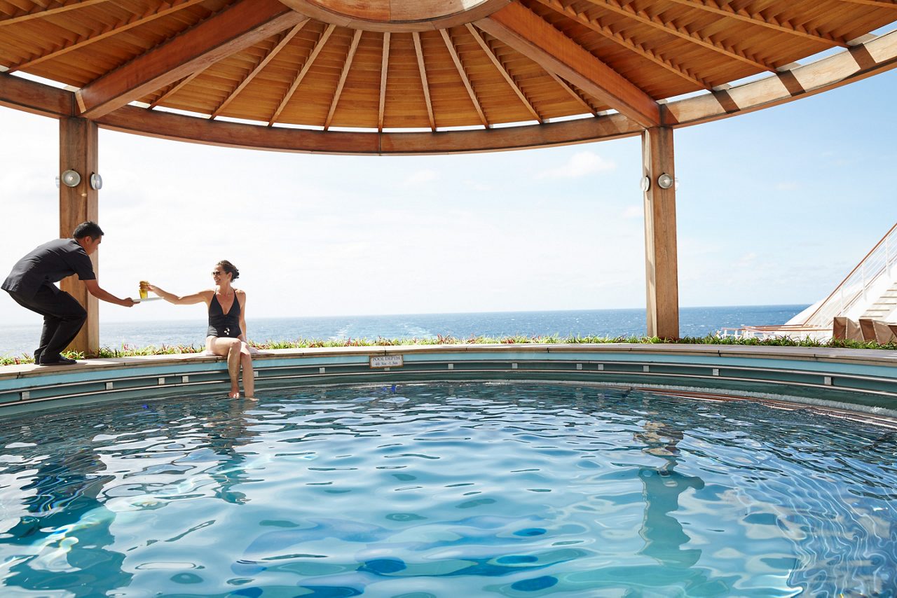 Woman sitting by the Izumi Japanese bath on Diamond Princess.