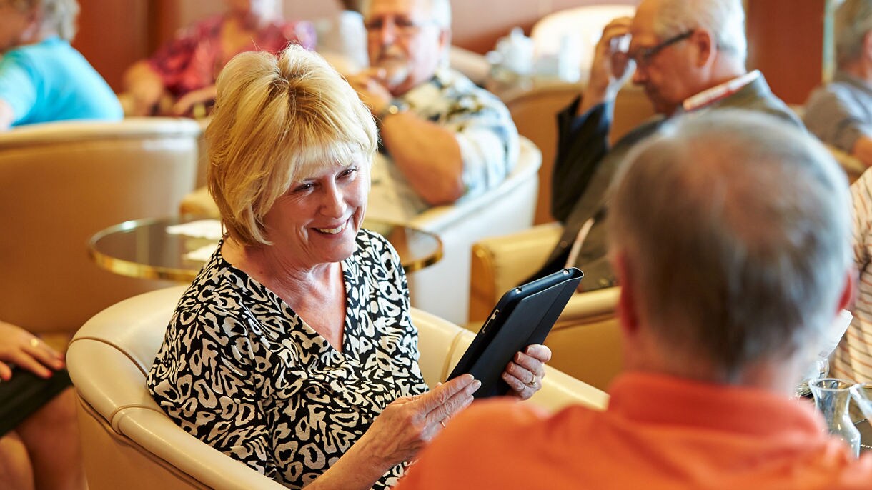 Lounge group woman holding ipad device