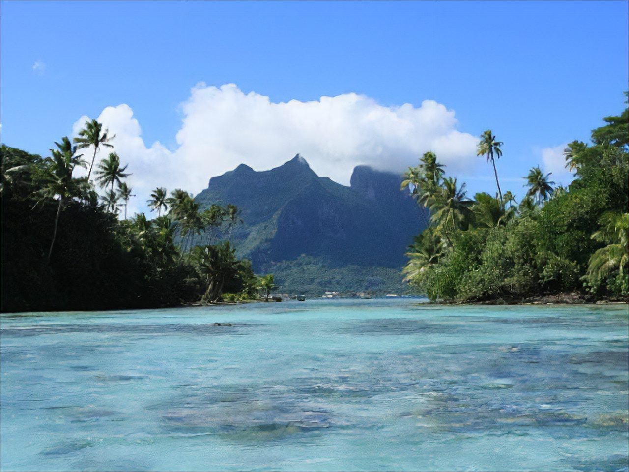 Luganville, Vanuatu’s turquoise ocean and lush mountains.