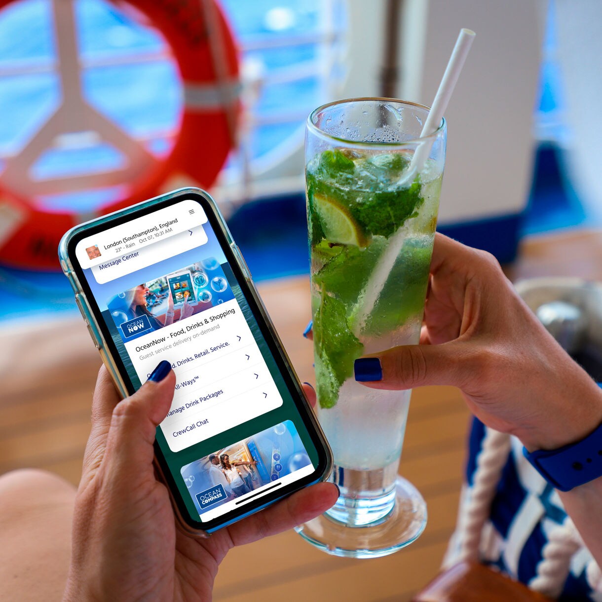 using phone on deck while drinking a cocktail