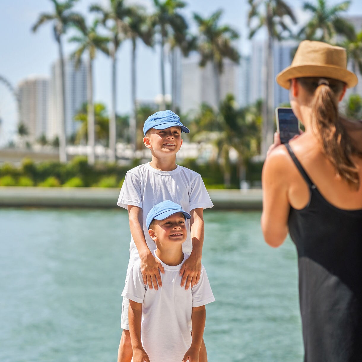 Picture from Miami of mother taking picture of sons
