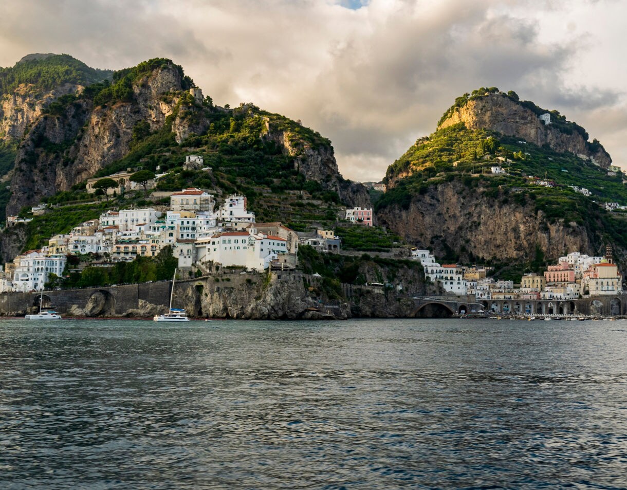 Seaside town on the Amalfi Coast with colorful houses built into steep cliffs overlooking
