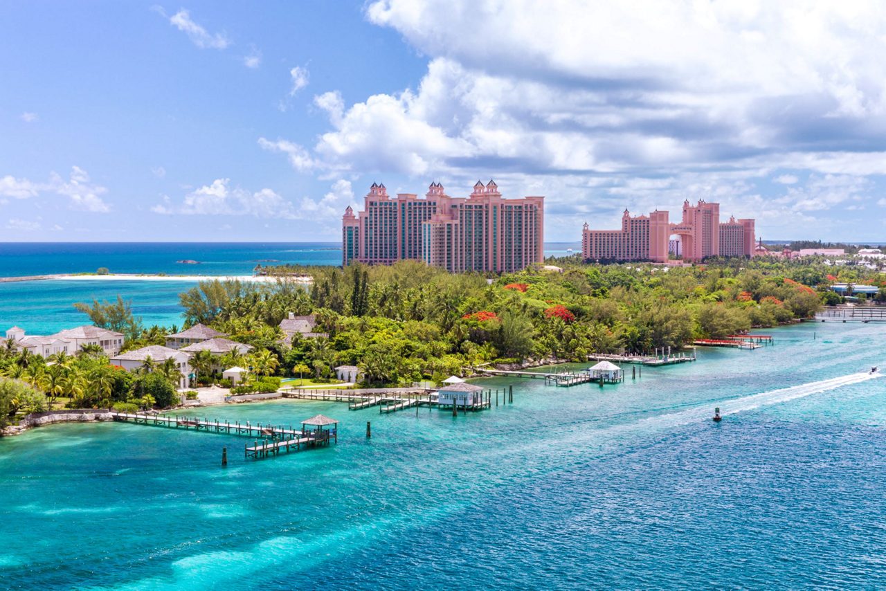 Aerial view of Paradise Island, Nassau, Bahamas, featuring the iconic Atlantis Resort and vibrant turquoise waters. 