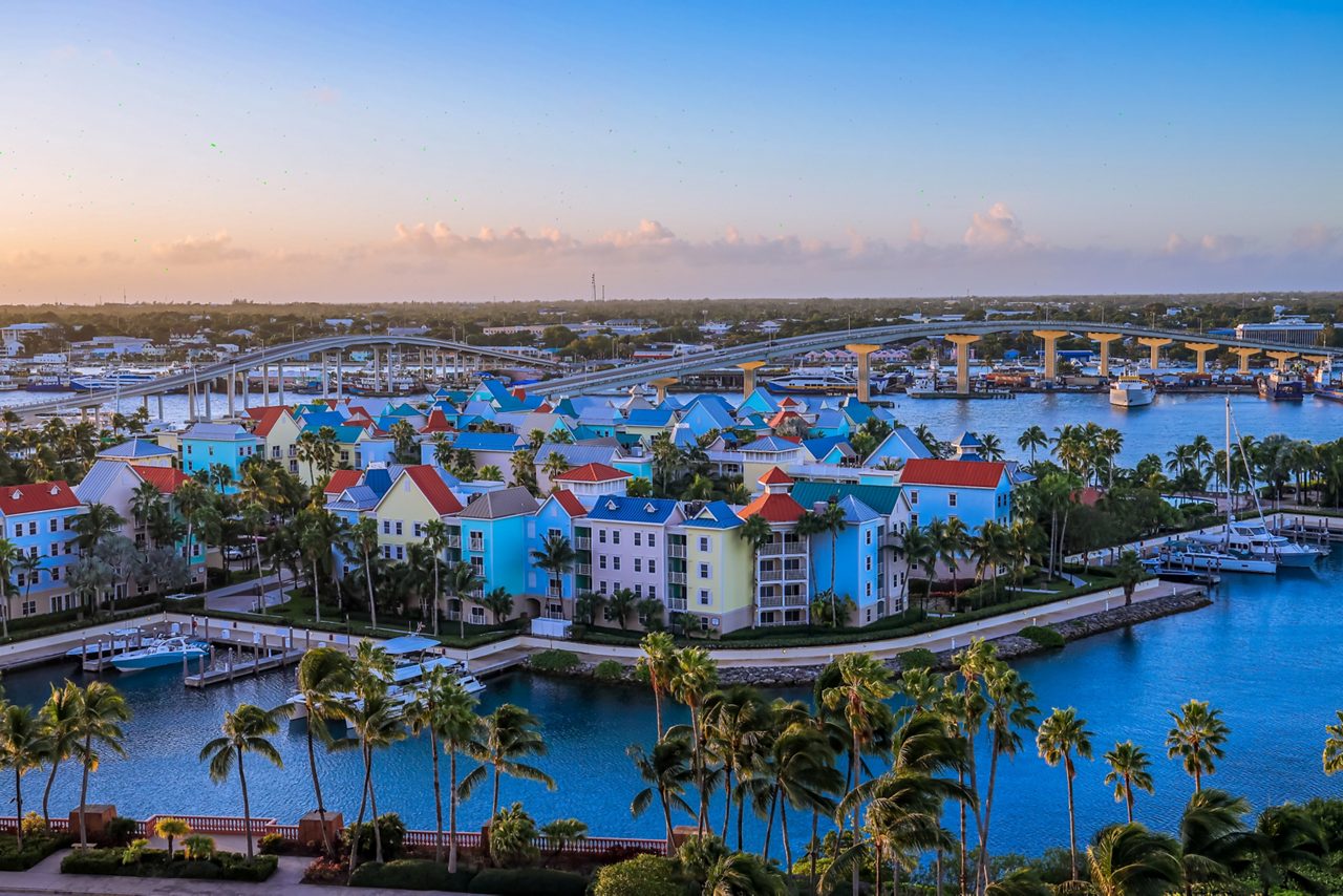Aerial view of Paradise Island, Nassau, Bahamas, featuring the iconic Atlantis Resort and vibrant turquoise waters. 