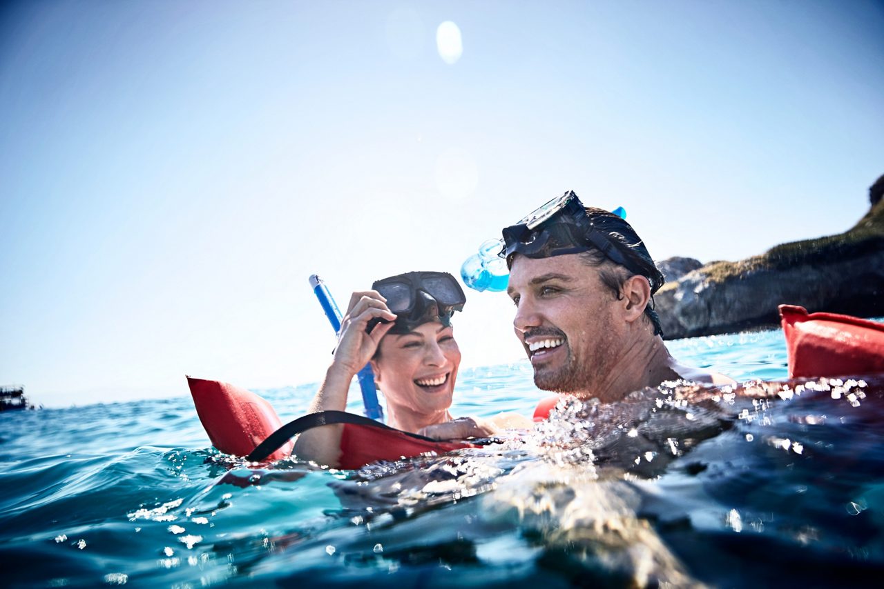 Couple snorkeling in the ocean