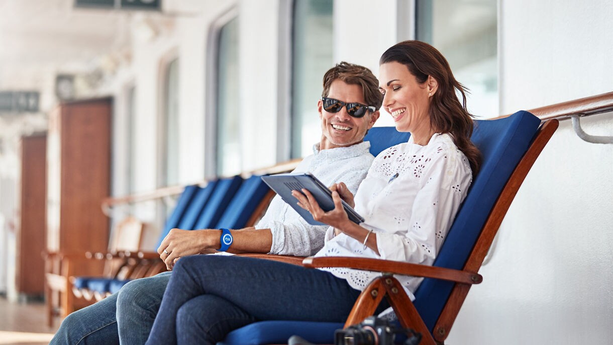 MedallionNet logo. A family using MedallionNet while out on deck.