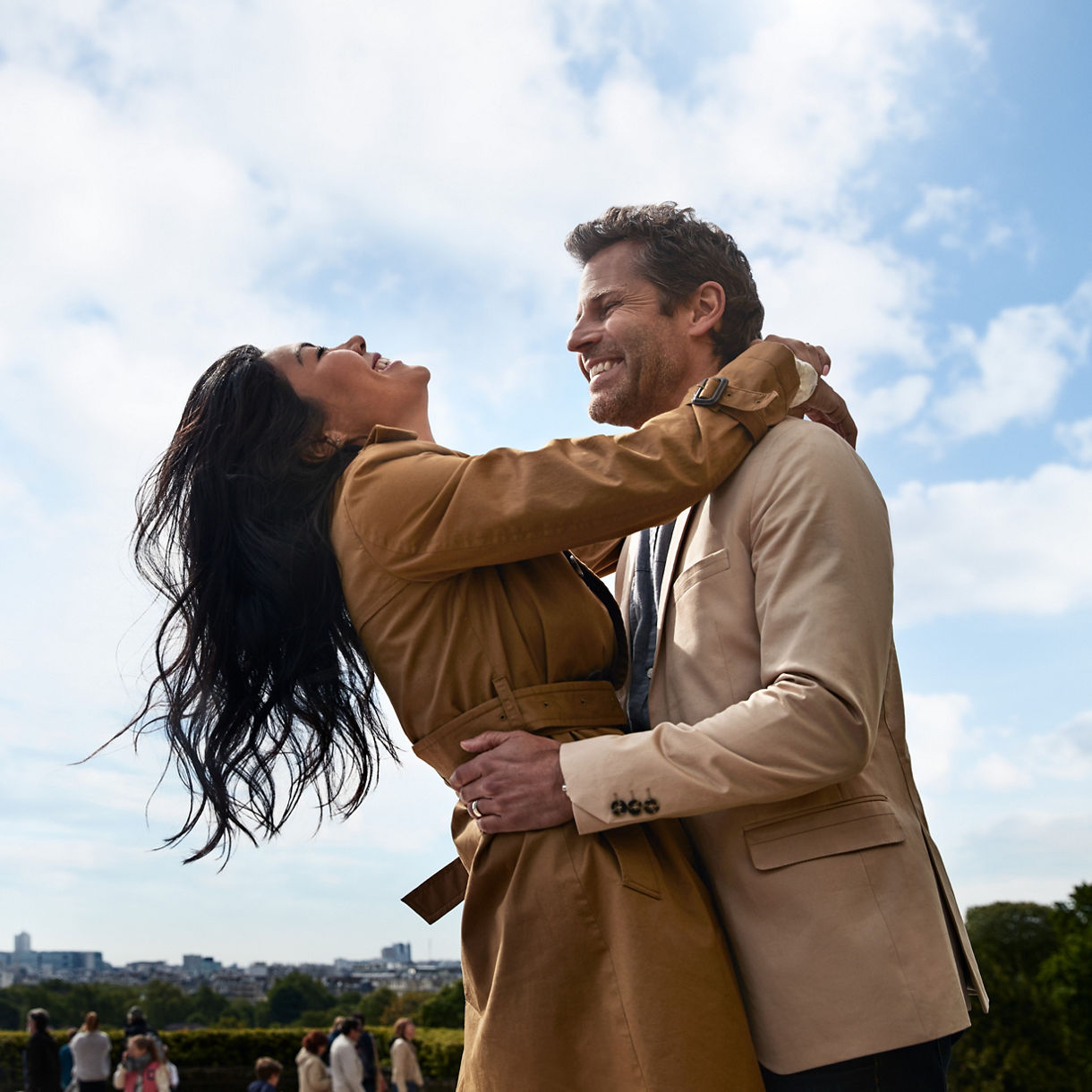 paris france eiffel tower couple embrace daytime