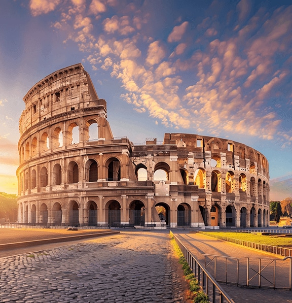 A dramatic sunset at the Colosseum in Rome, Italy.