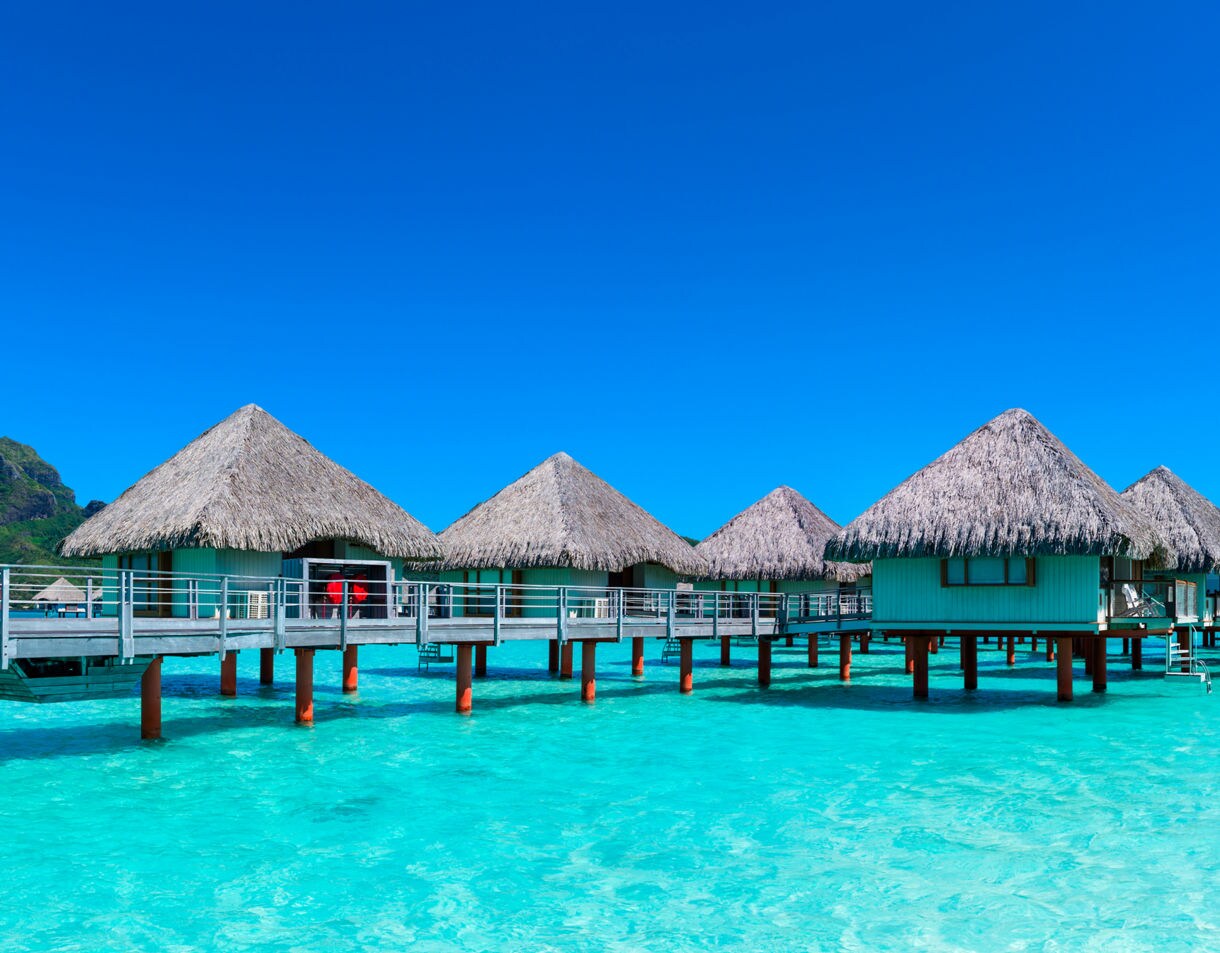 Cabins over a clean and pristine blue sea
