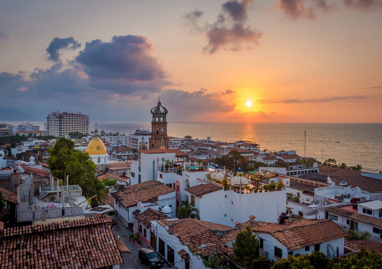 Puerto Vallarta's vibrant cityscape at sunset.