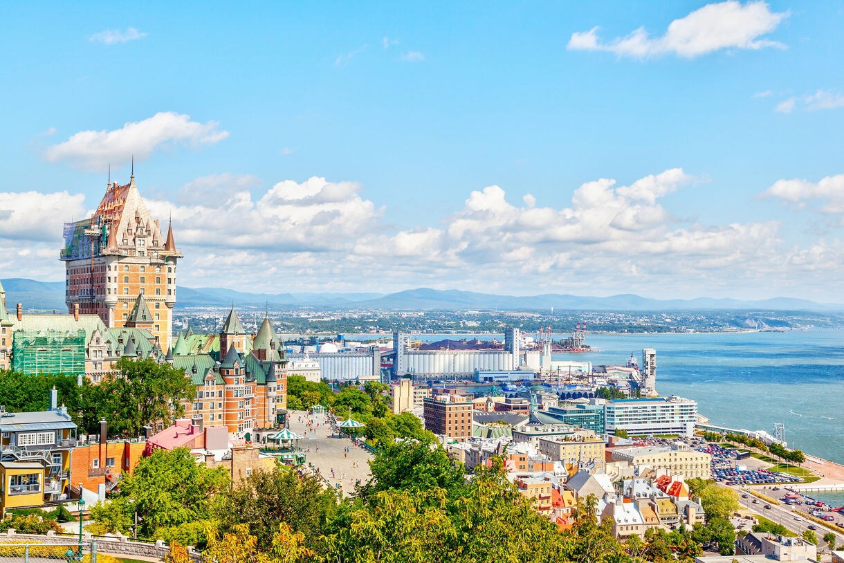 Château Frontenac rising above Old Québec with the St. Lawrence River in the background.