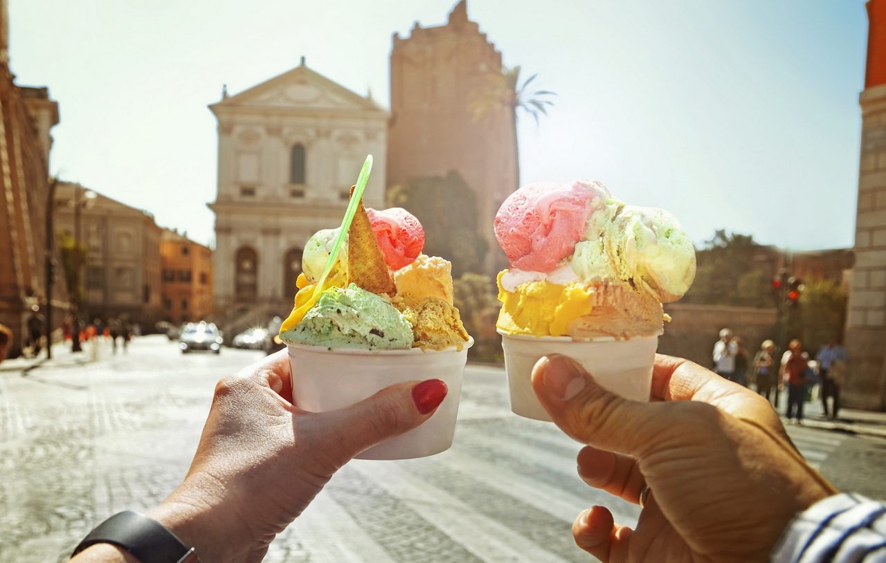 A couple enjoying gelato in Rome, Italy.