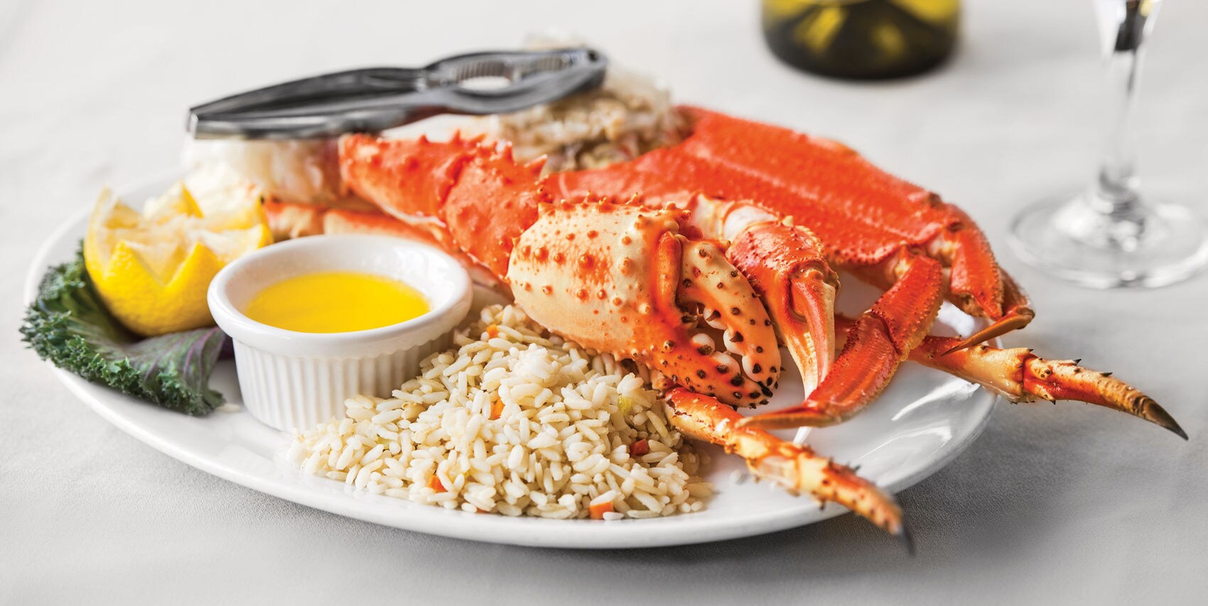 A plate of fresh Alaskan seafood including crab legs.