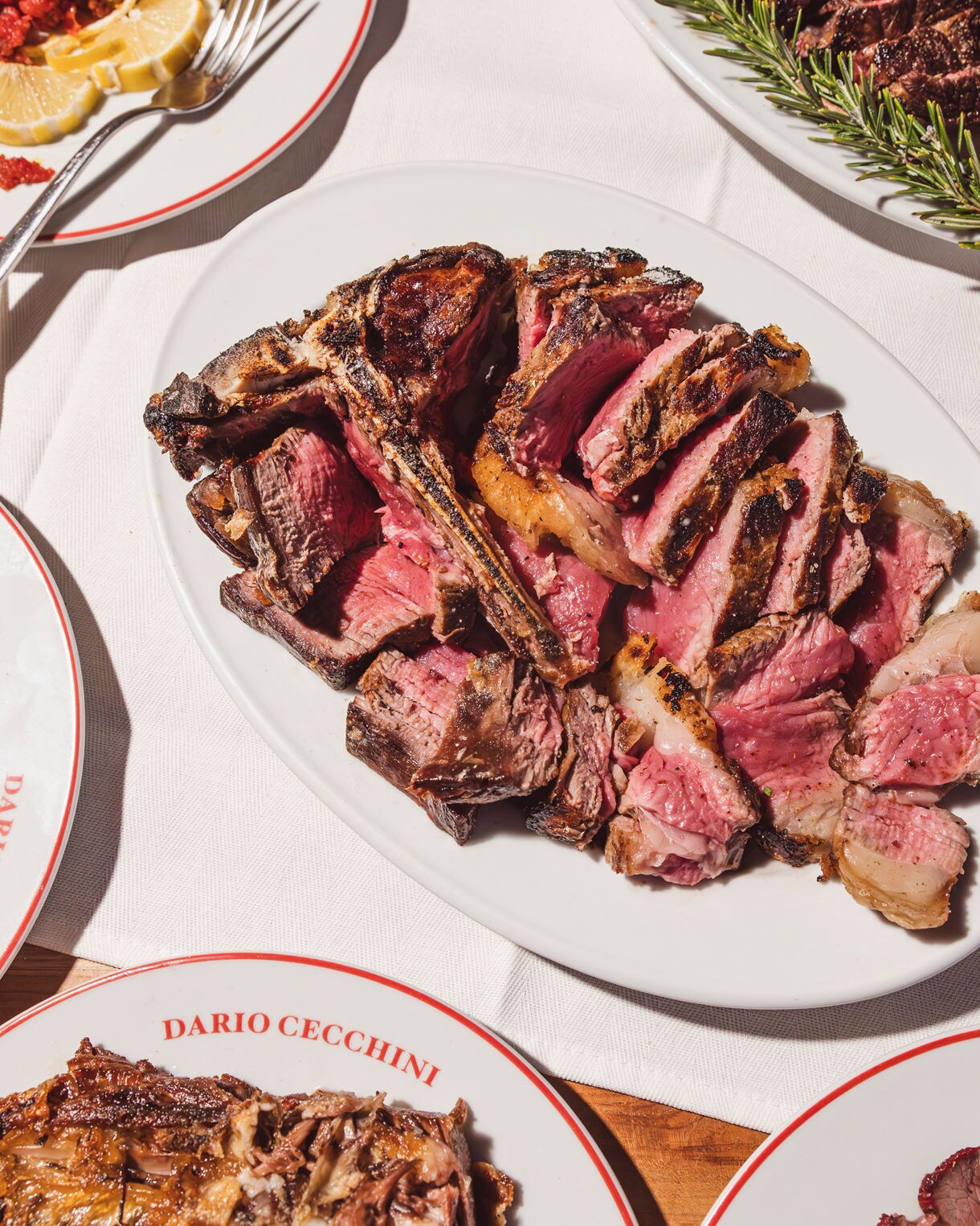 Juicy cut steak served on a white plate