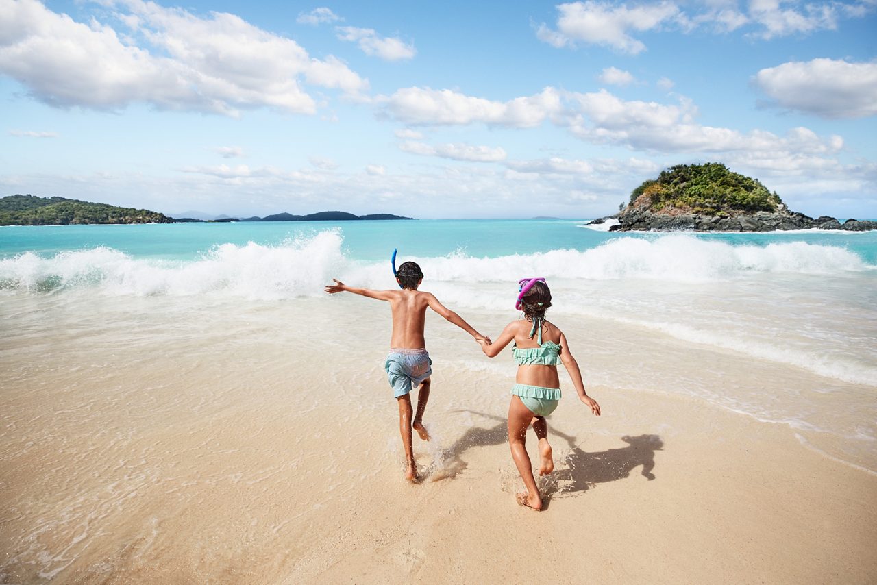 kids on beach, running towards ocean