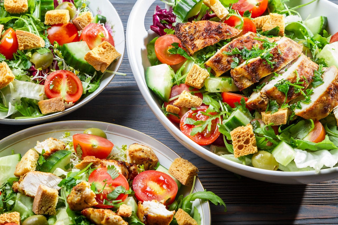 Three plates of salad